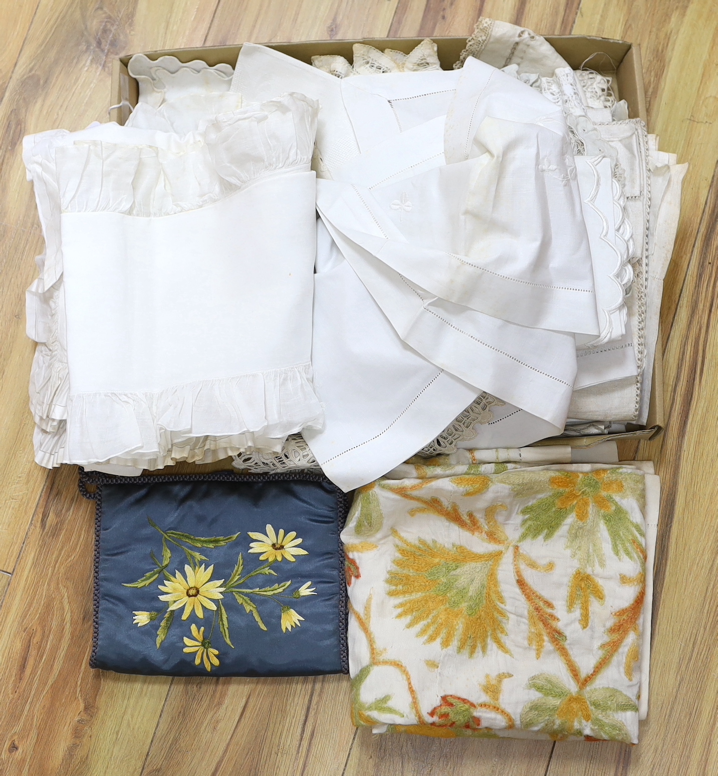A small group of embroidered, drawn thread and cut-worked table linens